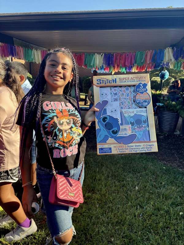 Student who won a Stitch Activity Pack in Loteria.
