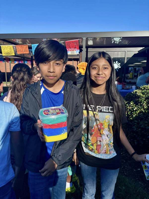 Family members who won a bucket of bouncy putty in Loteria.