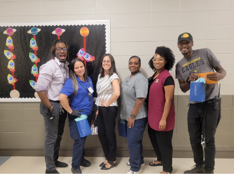 Acting principals pose with the Morris custodial staff 