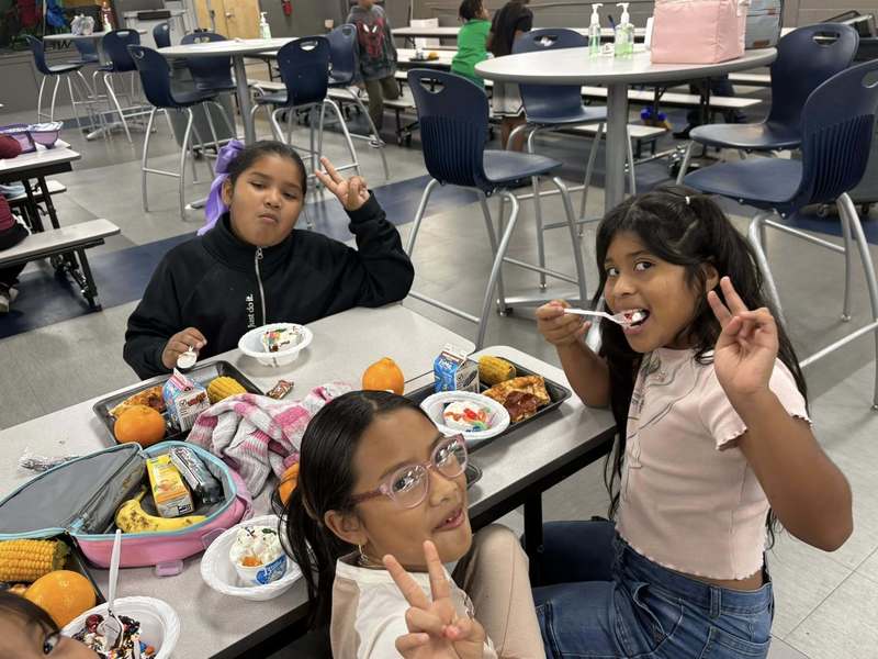 Third graders celebrating their positive behavior choices with sundaes and smiles.