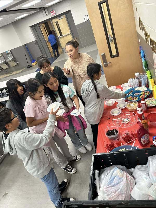 Fifth graders excited about all the topping choices they had for their sundaes on the sundawe bar.
