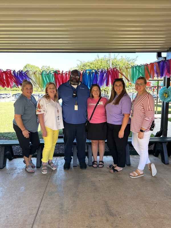 Mr. Wyan accepting his award with staff members and community members.