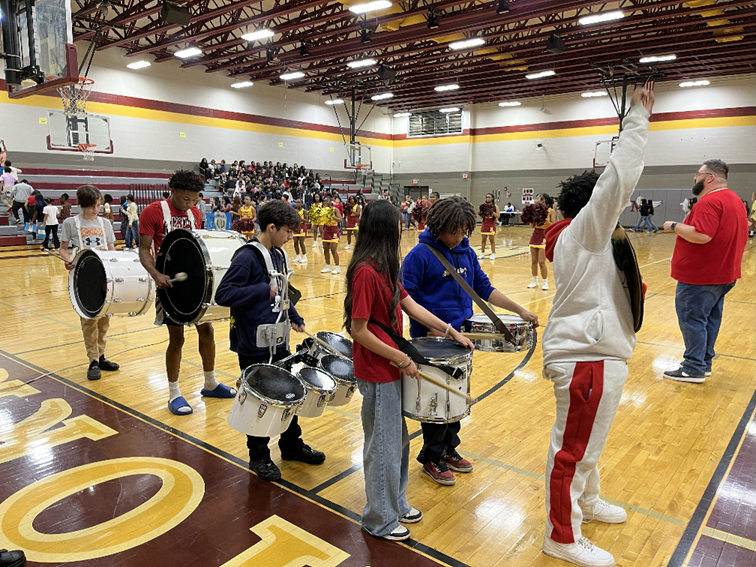 The MMS drumline lead the parade to the gym