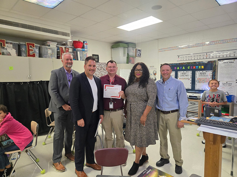 Toyota AL leadership pose with school and district leaders at Rolling Hills