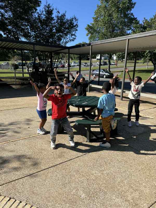 Students dancing to the YMCA in the courtyard.