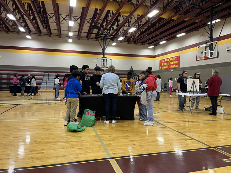 Students gather around the Green Ambassador table