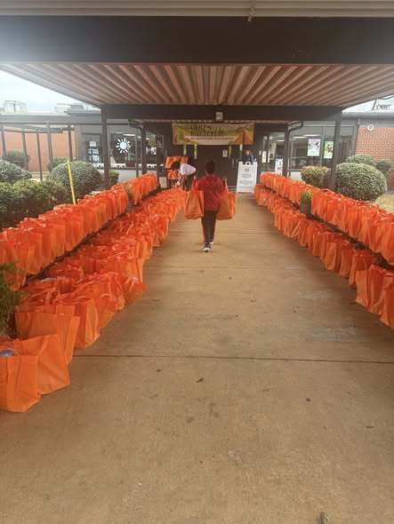 Bright orange bags lining the front sidewalk of our school.