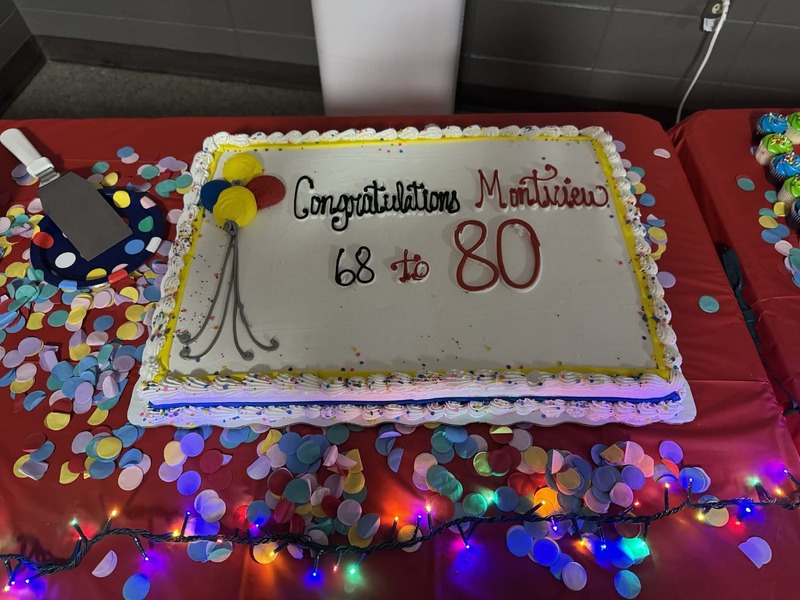 Our cake that says "Congratulations Montview 68 - 80."