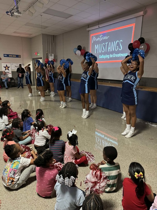 Lee High School cheerleaders doing a cheer for the school.