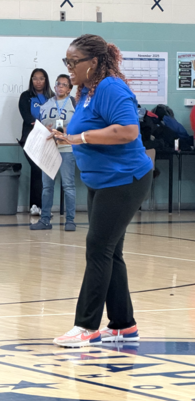 Mrs. Peavy, Chapman Principal, is addressing the student body and staff at the ACAP & State Report Card Celebration in the gym.