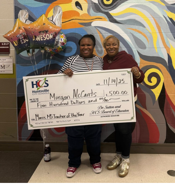 Dr. Burruss presents Ms. McCants with a check for $500