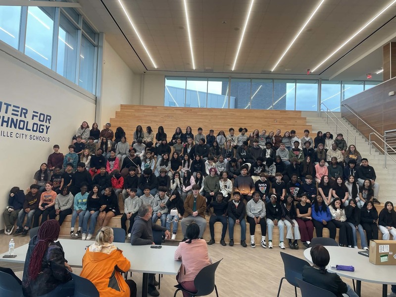 Students from Morris Middle School sit on the stairs at HCT