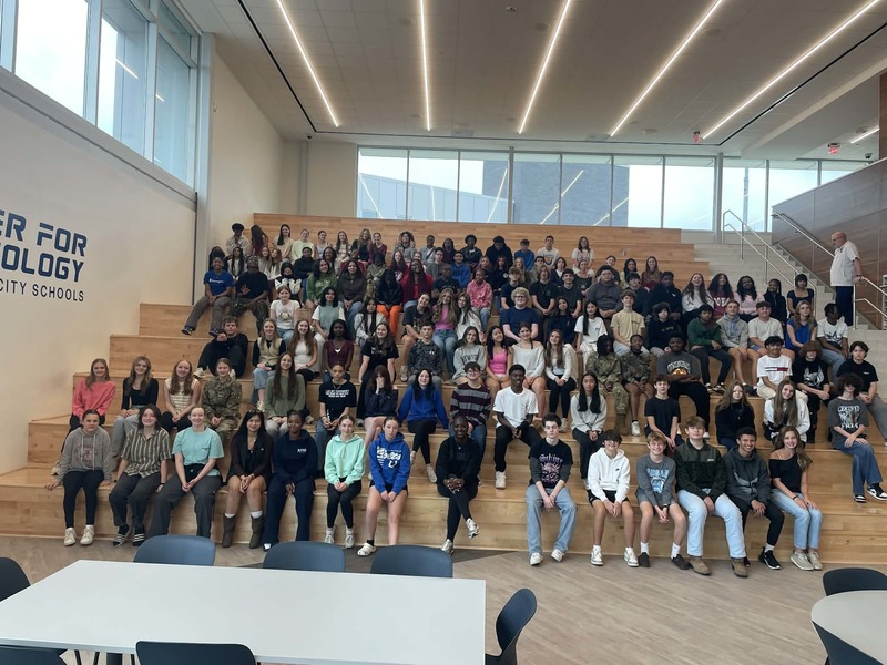 Huntsville High School students sit on the stairs at HCT