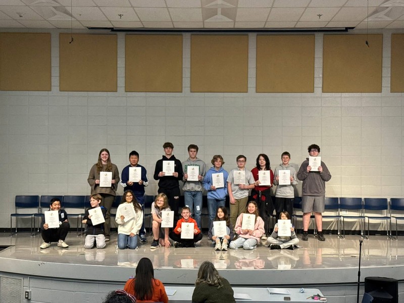 The CMS school wide participants. holding their participation awards.