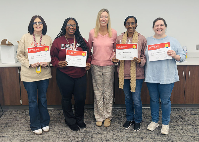 Ridgecrest teachers and staff show their completion certificates