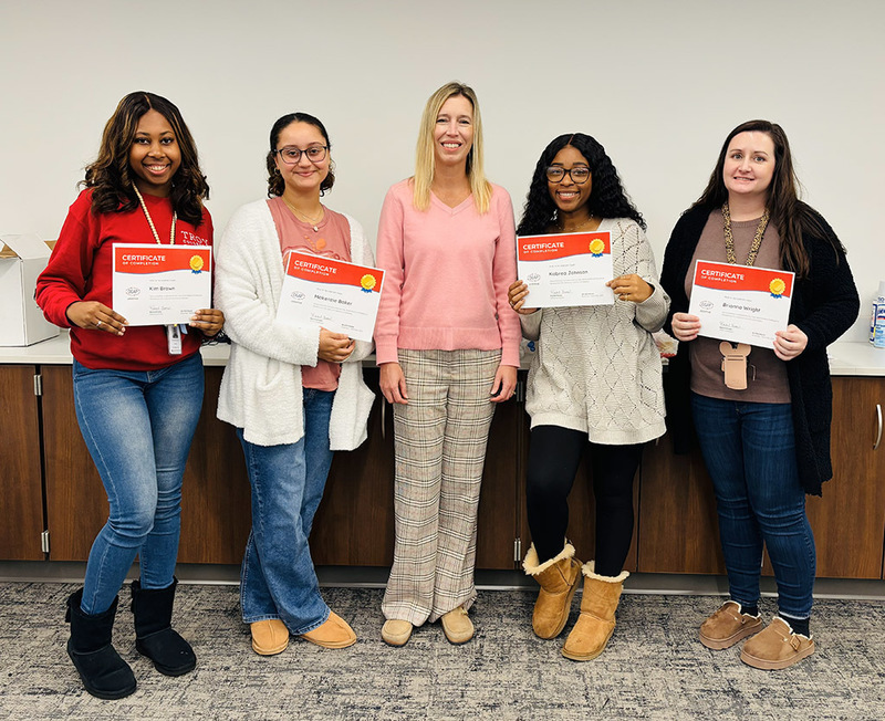 Providence teachers and staff show their completion certificates