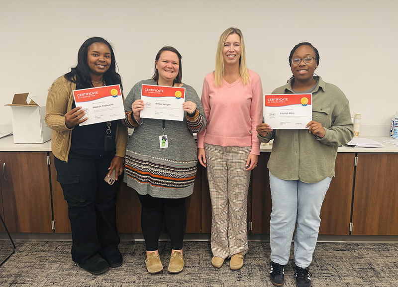Williams teachers and staff show their completion certificates