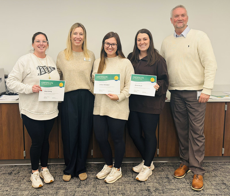 Whitesburg teachers and staff show their completion certificates
