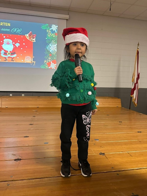 A sweet Kindergartener was the only one who came. She sang "Santa Is His Name Oh."