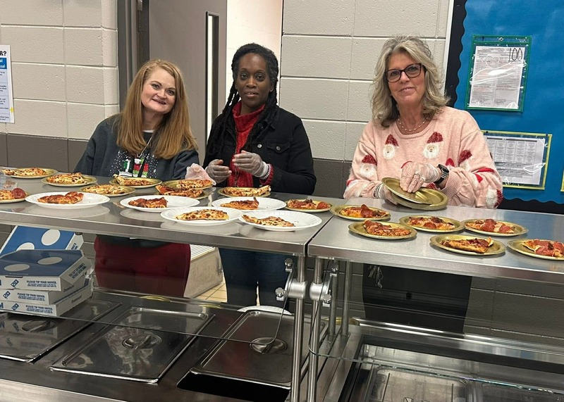Our counselor, Dana Jetton, our PTA President, Sitka Poon, and our Assistant Principal, Julie Boissel  serving pizza to guests.