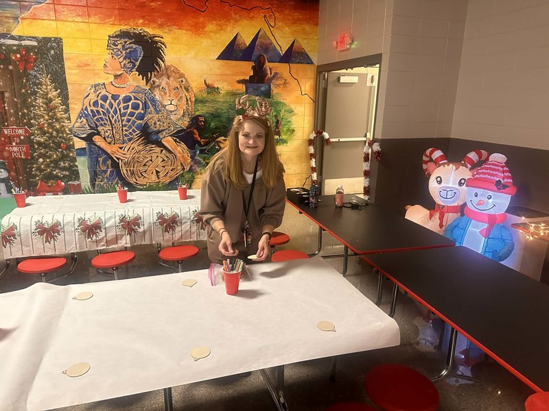 Mrs. Jetton is getting ready for the students to color their wooden ornaments.