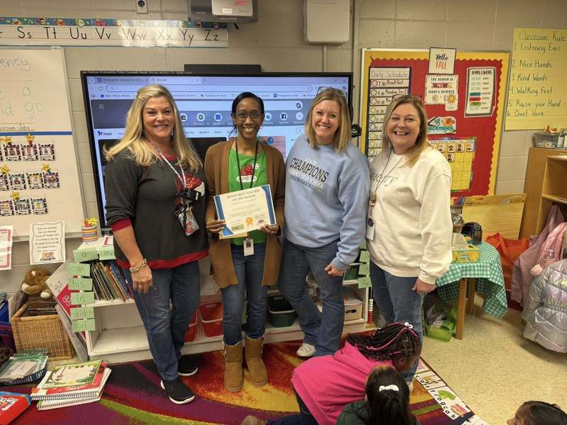 Ms. Ellison receiving her award for Teacher of the Month