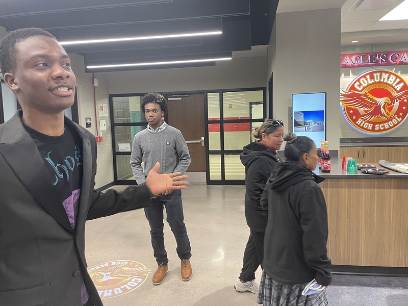 Students and parents standing in front of the Columbia Eagle Cafe