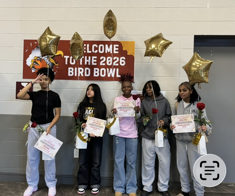 Members of the Girls Basketball team  pose with their recognition certifiates and balloons after their  8th Grade  Recognition ceremony