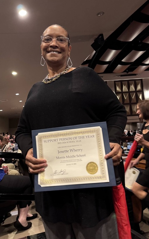 Mrs. Wherry poses with her certificate