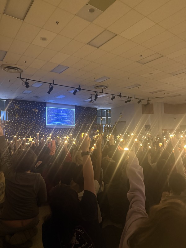 Students with a candlelight ceremony during the presentation. 