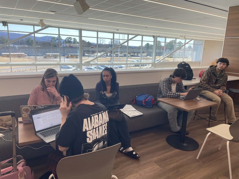 Students work with Ms. Nancy Wolfe on their FAFSAs