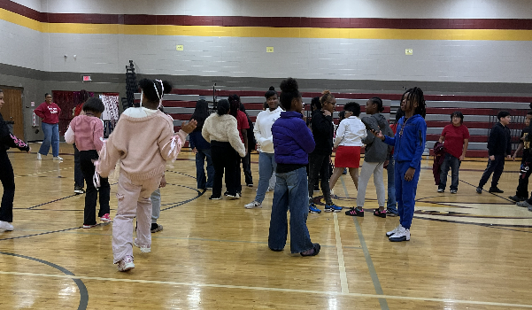 Students dance in the gym