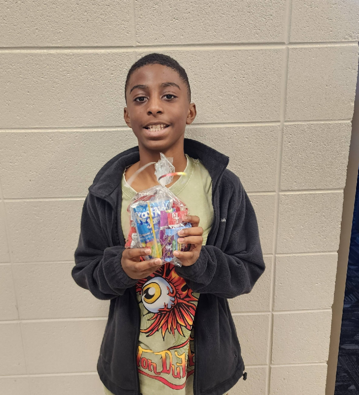 Elijah poses with his treats