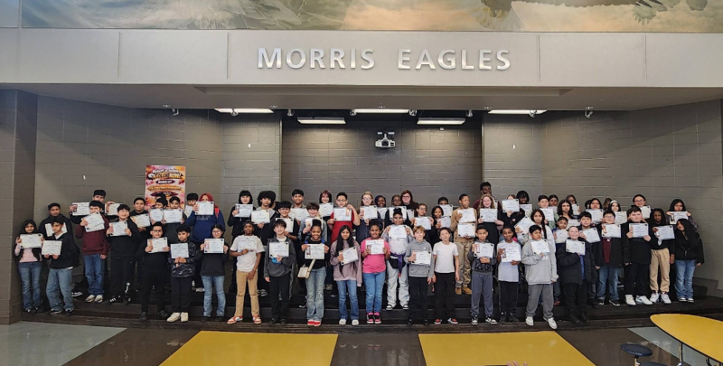students pose with their certificates