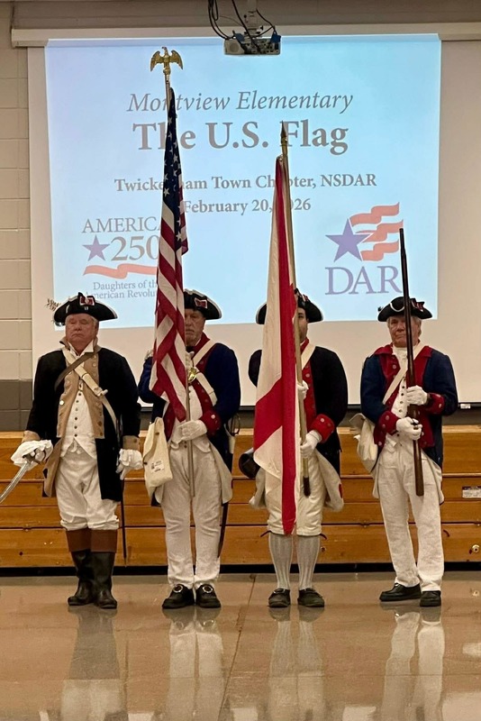 Men from DAR presenting the flags dressed up like the American Revolution Soldiers.