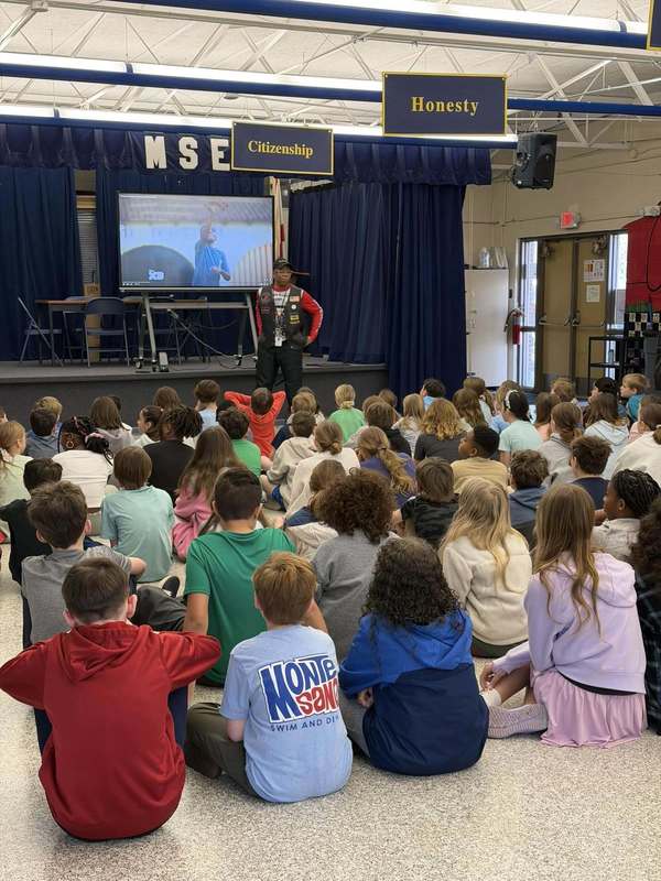 students sitting watching presentation