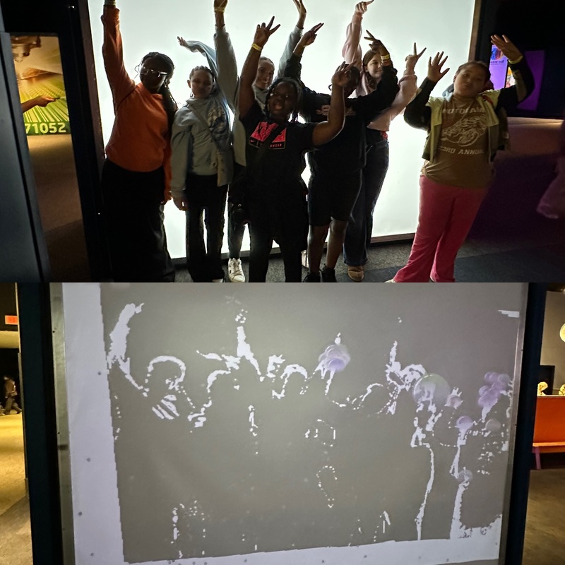 Students from CMS doing a science experiment with light at a science center.