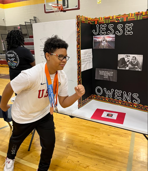 Student reprenting Jesse Owens