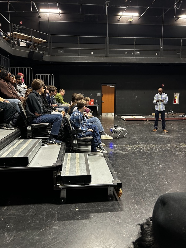 Students view a drone demonstration in the Black Box Theater.