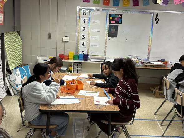 Fifth graders from Ms. Treece's class working hard on their math in art project. 