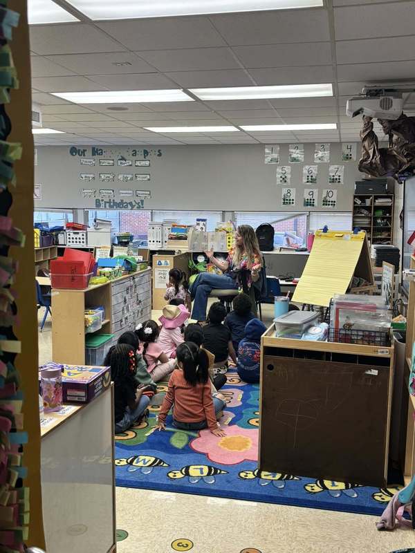 Ms. Legg reading to a PreK class