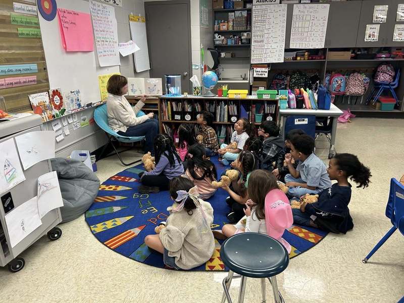 Guest reader reading to a Kindergarten class