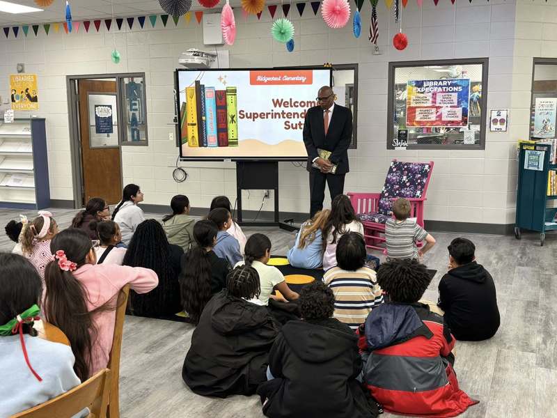 Superintendent Sutton visiting with fifth graders