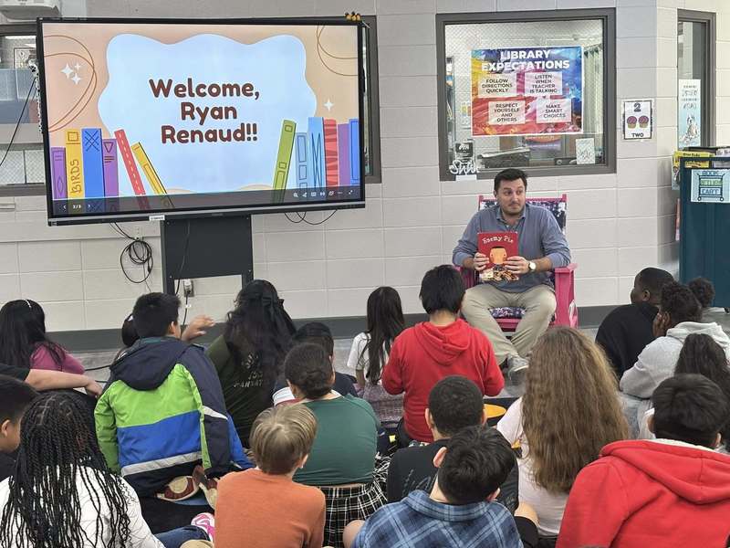 Ryan Renaud talking with fourth grade