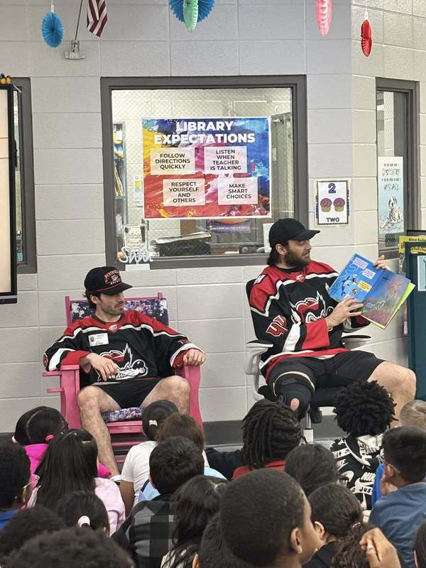 The Havoc players read books about animals to third grade