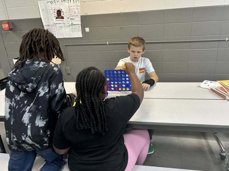 These fourth graders are very serious about Connect Four!