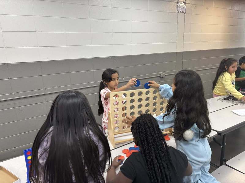 Second graders having fun with a very large Connect 4 game!