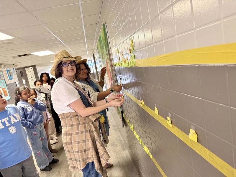 Ms. Barksdale and Ms. Johnson helping their classes with plot lines.