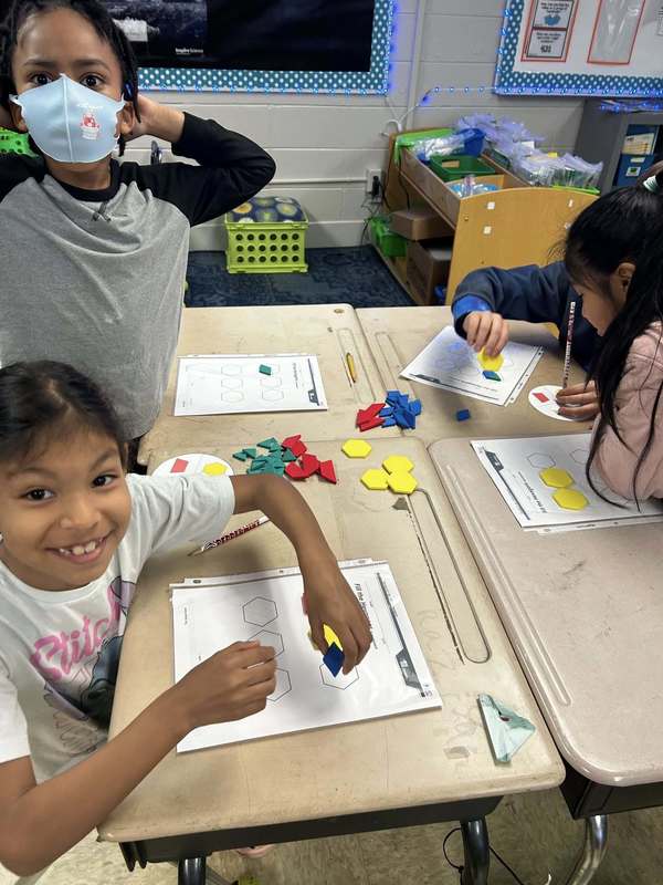 Second graders using tangrams in the ACAP Experience.