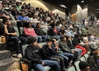 Students await the beignning of Frozen at Grissom High School's theater.